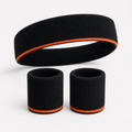 Black headband and two wristbands with orange stripe