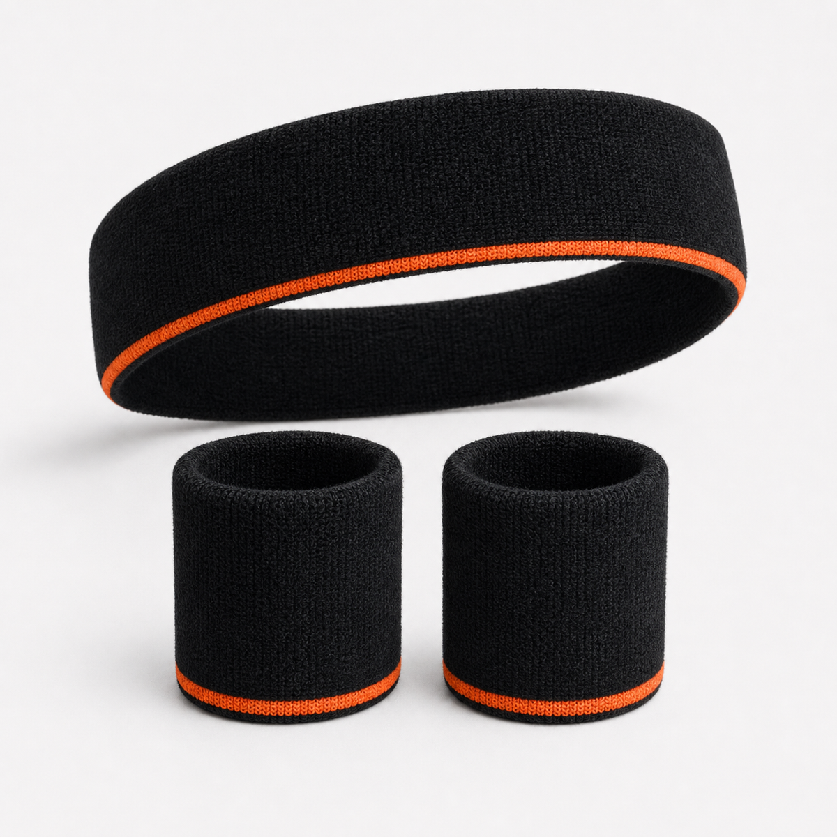 Black headband and two wristbands with orange stripe
